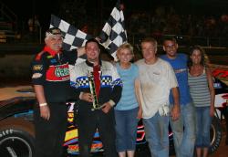 Kevin Sitton enjoys victory lane. (scottscustomsart.com)