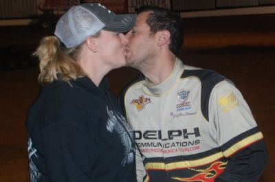 Angie Van Wormer kisses her winning husband. (DirtonDirt.com)