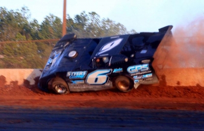 Jonathan Davenport wrecked after taking the checkers. (Clifford Dove)