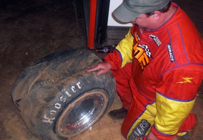 Vic Coffey examines his dooming flat tire. (Kevin Kovac)