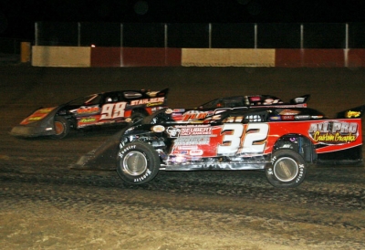 Jason Rauen (98) fights off Terry Anvelink (32) and others at Dubuque. (Paul Misner)