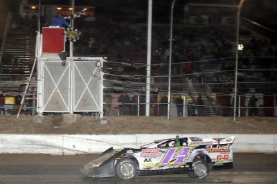 Brad Looney takes the checkers in Greenwood, Neb. (fasttrackphotos.net)