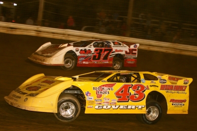 Jared Hawkins (37) takes the lead from Jason Covert (43a) in the final laps. (Tommy Michaels)