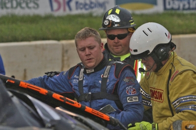 Eriez Speedway safety workers pull Kent Robinson from h is car after a heat accident. (Todd Battin)