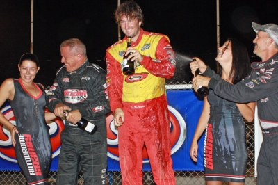 The top three ham it up in victory lane at Autodrome Granby. (Kevin Kovac)
