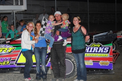 Jason Schierkolk and supporters celebrate in victory lane at Casper Speedway. (andrewtownephotography.com)
