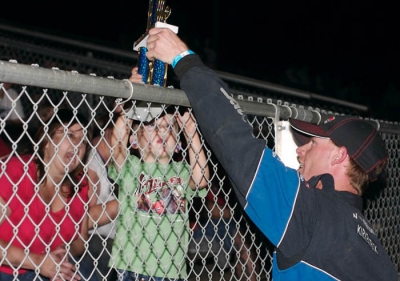 A.J. Kirkpatrick hands off his dash trophy. (raceimages.net)
