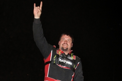 Randy Weaver salutes the crowd from atop his car. (Chad Wells)