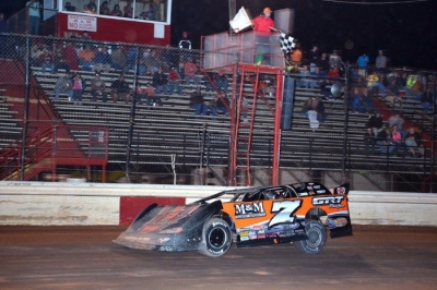 Jason Fitzgerald takes the checkers at Waycross. (Troy Bregy)