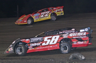 Jeff Aikey (77) held off the late charge of Ray Guss Jr. (58). (Barry Johnson)
