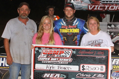 Kyle Beard and his car owners, the Upton family. (Woody Hampton)