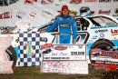 Devin Moran poses in victory lane after winning May 11&#039;s Lucas Oil Series-sanctioned FALS Spring Shootout at Fairbury (Ill.) Speedway. (heathlawsonphotos.com)