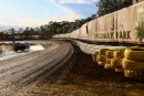 A look at Volusia's infamous backstretch sign as track officials begin to apply moisture to the surface in preparation of Thursday's 35-lap, $12,000-to-win DIRTcar Nationals fourth round. (joshjamesartwork.com)
