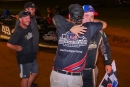 Sam Seawright gets a hug from team owner Brett Coltman after his first DIRTcar Summer Nationals victory June 29 at Camden (Tenn.) Speedway. (joshjamesartwork.com)