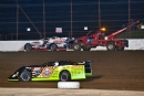 Scott Bloomquist (0) won the first Show-Me 100 heat after taking the lead from Will Vaught (1), who was forced out with iginition problems. (thesportswire.net)