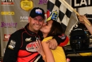 Mike Marlar gets a kiss from wife Stacy after June 15's Lucas Oil Clash at the Mag victory at Magnolia Motor Speedway. (rickschwalliephotos.com)