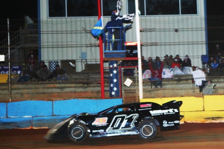 Travis Pennington takes the checkered flag Nov. 16 at Deep South. (ronskinnerphotos.com)