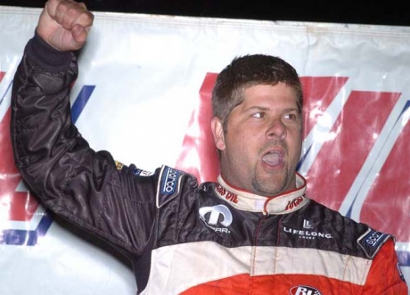 Earl Pearson Jr. celebrates in victory lane. (Eric Thompson)