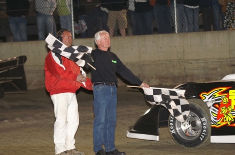 The race honoree's father saluted the field. (Dana Royer)