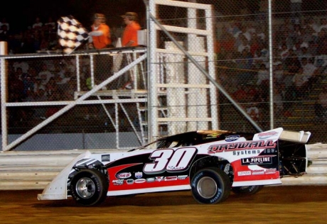 Steve Shaver takes the checkered flags. (Jim DenHamer)