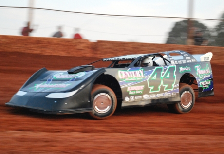 Chris Madden tunes up before his $10,000 victory. (Kyle Armstrong)