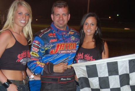 Brian Shirley picks up the Farmer City checkers. (Terry Young)