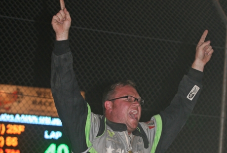 Jason Feger celebrates a win and title at Attica. (Todd Battin)