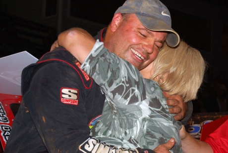 Anthony Burroughs gets a hug from Janet Sandrell. (photobyconnie.com)