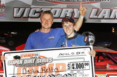 Austin Rettig and his father Alan celebrate the April 9 victory. (Woody Hampton)