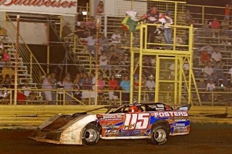 Brandon Smith takes the checkers at 67 Speedway. (Woody Hampton)