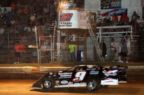 Mike Jewell takes the checkers at Richmond. (Jimmy Pittman)