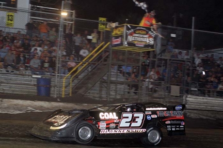 John Blankenship crosses the finish line for $10,000 at Volusia. (stlracing.com)