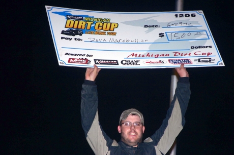 Dona Marcoullier shows of his earnings at Winston Speedway. (Steve Datema)