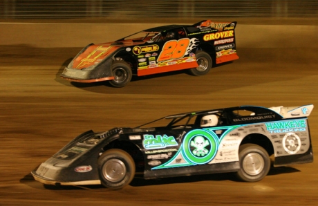 Eddie Carrier Jr. (28) battles Scott Bloomquist (0). (Jim DenHamer)