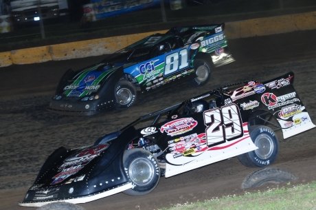 Scott James (81) works around Darrell Lanigan (29). (mikerothphotography.com)