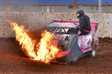 James Plemmons climbs from a fiery crash; he wasn't hurt. (Gary Laster)