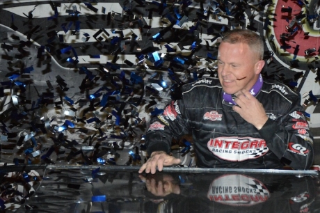 Darrell Lanigan emerges from his car amid victory lane confetti. (Jason Shank)