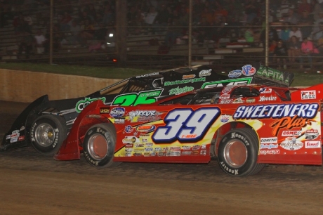 Tim McCreadie (39) and Shane Clanton (25) battle at I-30. (Woody Hampton)