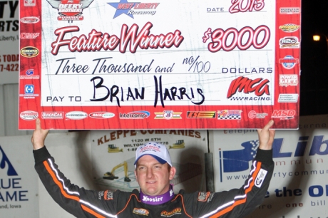 Brian Harris shows off his big check at West Liberty. (Rick Neff)