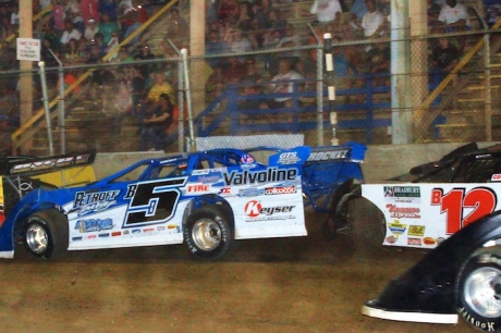 Kevin Weaver (B12) gets caught up on the frontstretch wall. (Jim DenHamer)