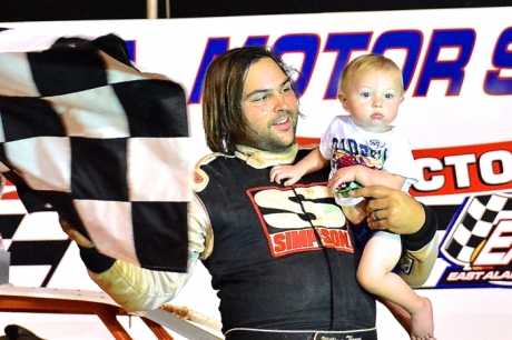 William Thomas celebrates with son Nolan in victory lane. (Eric Gano)