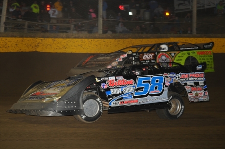 A.J. Diemel (58) puts a lap on Scott Bloomquist at Cedar Lake. (chrisburback.com)