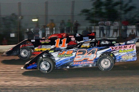 Rusty Schlenk (11) battles polesitter Ky Harper (34). (Jim DenHamer)