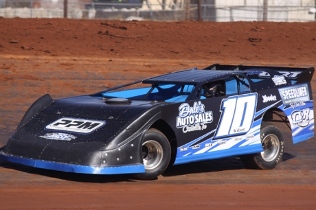 Chris Wilson tunes up before his $3,000 victory. (circlesville.com)