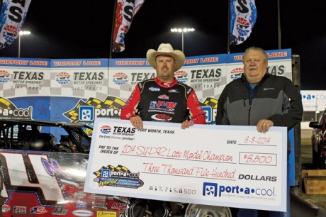 Morgan Bagley holds his first-place check. (Getty Images)