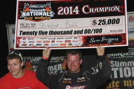 Shannon Babb holds his championship check. (Jim DenHamer)