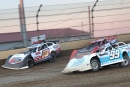 Ryan Gustin (19r) and Devin Moran (99) battle for the lead late June 10 at Kokomo (Ind.) Speedway. Moran won the $15,000 XR Super Series race by a sliver at the checkers. (Jim DenHamer)