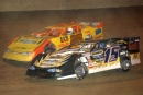 Brian Birkhofter (15B) of Muscatine, Iowa, charges underneath Shane Clanton (25) and paced the final 25 laps to win the $10,000 DIRTcar Summer Nationals stop at Eldora Speedway on July 12, 2003. (Todd Turner)