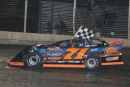 Dustin Strand carries the checkers after winning Sept. 5's Howie Schill Memorial at River Cities Speedway in Grand Forks, N.D., to wrap up his fifth Northern LateModel Racing Association title. (speedway-shots.com)