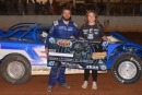 Ariel Bloomquist joined winner Camaron Marlar in victory lane Sept. 19 at Volunteer Speedway in Bulls Gap, Tenn., after his victory in the Scott Bloomquist Memorial Scorcher. (wellsracingphotos.com)